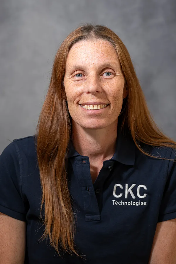 Headshot of Julie Franklin wearing a CKC Technologies Blue T-Shirt